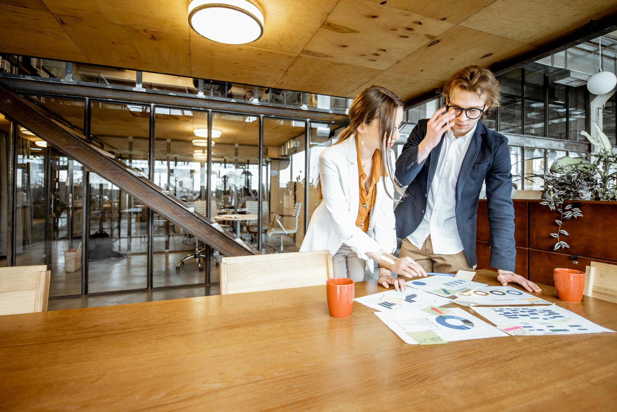 Man and woman working on documents in the office